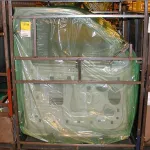 Car door panels packaged in ZERUST non-amine VCI film for shipment.