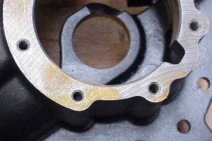 Close-up of rusted metal part stored on wooden pallet causing corrosion