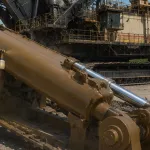 Sprayable Rust Preventative Coating being applied to mining equipment in the field